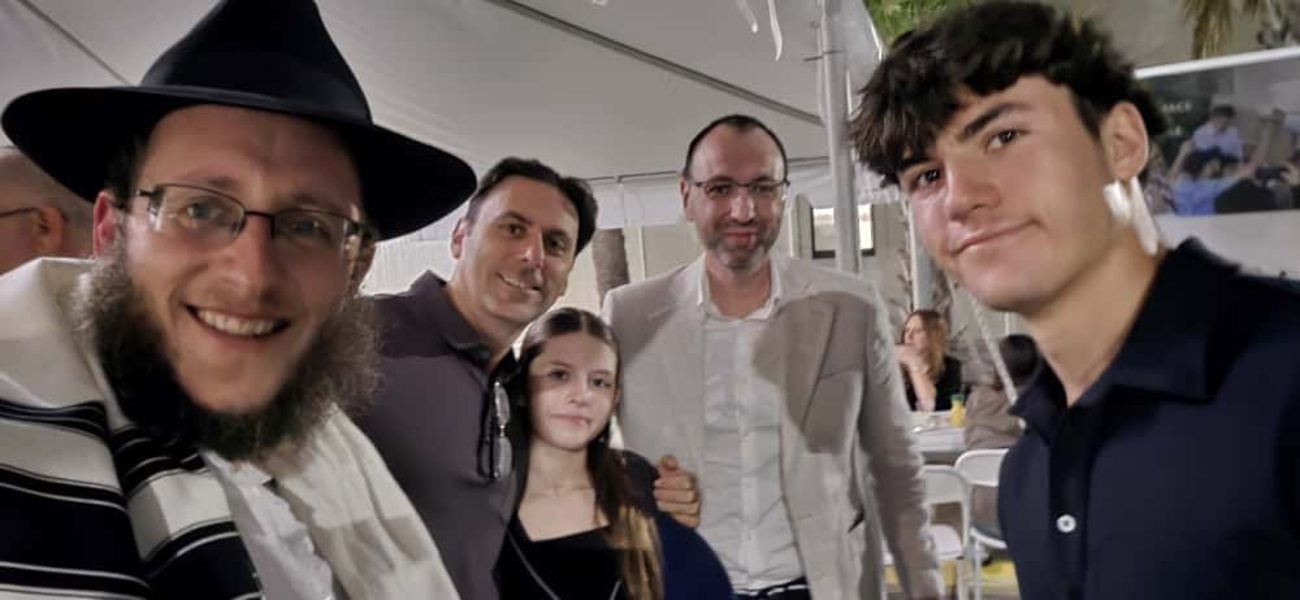 Teens sharing a Jewish moment with the rabbi