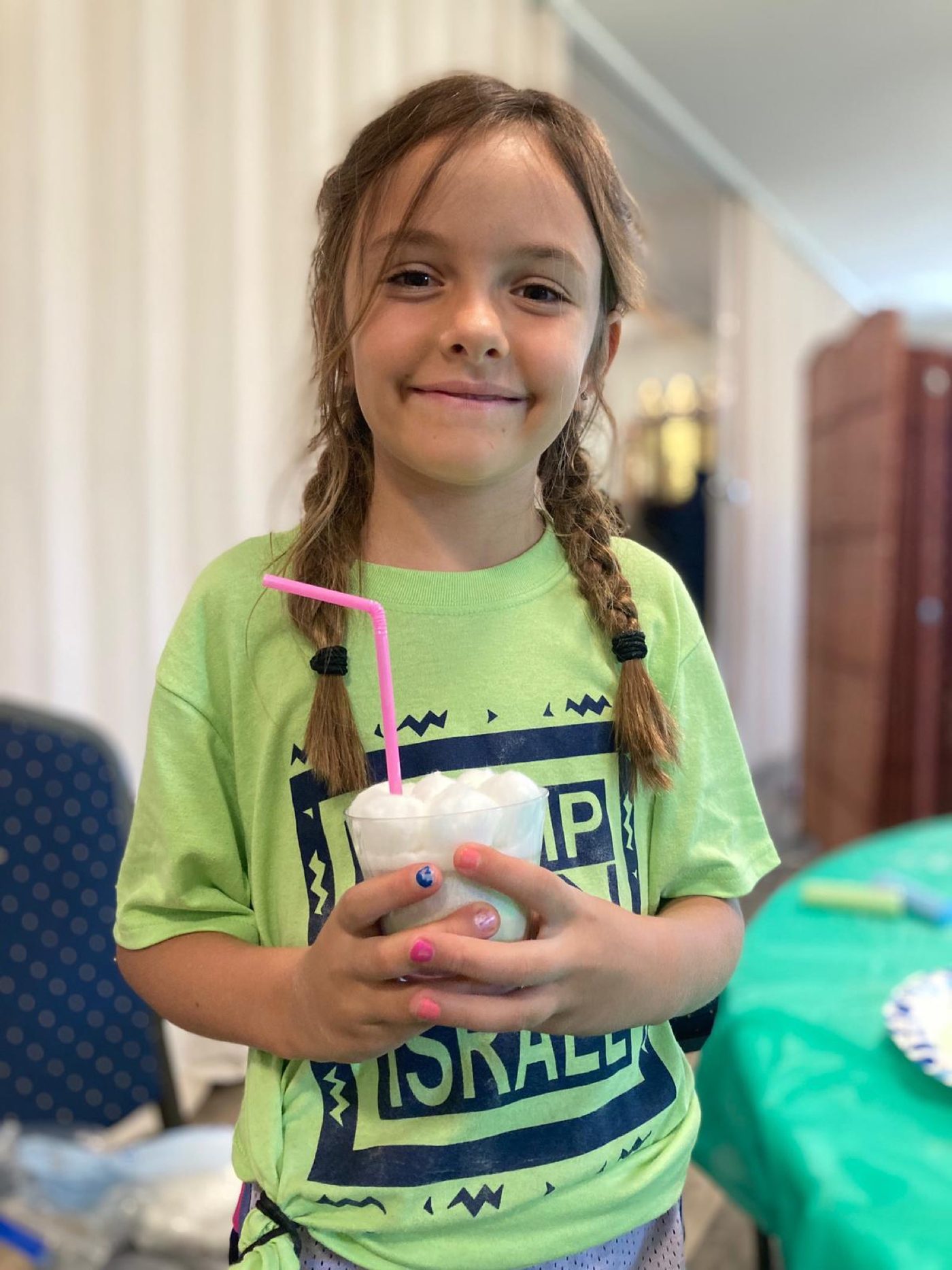 A young member of the community enjoying an ice cream float